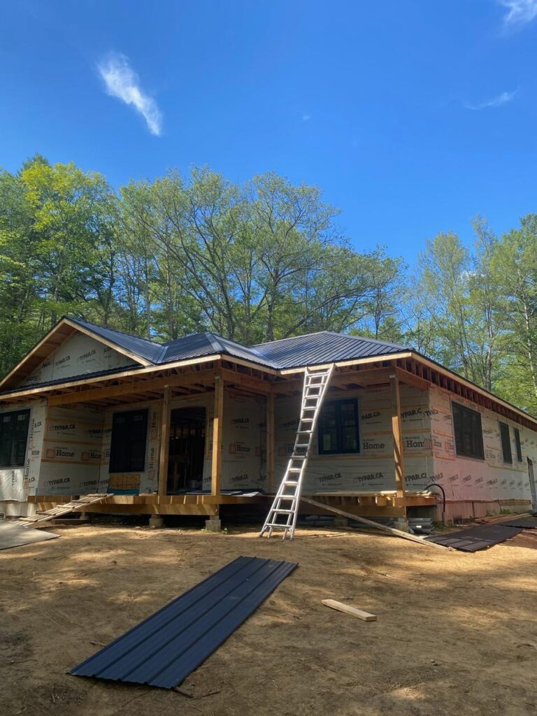 Standing seam metal roof installation by N.S. Custom Contracting Inc