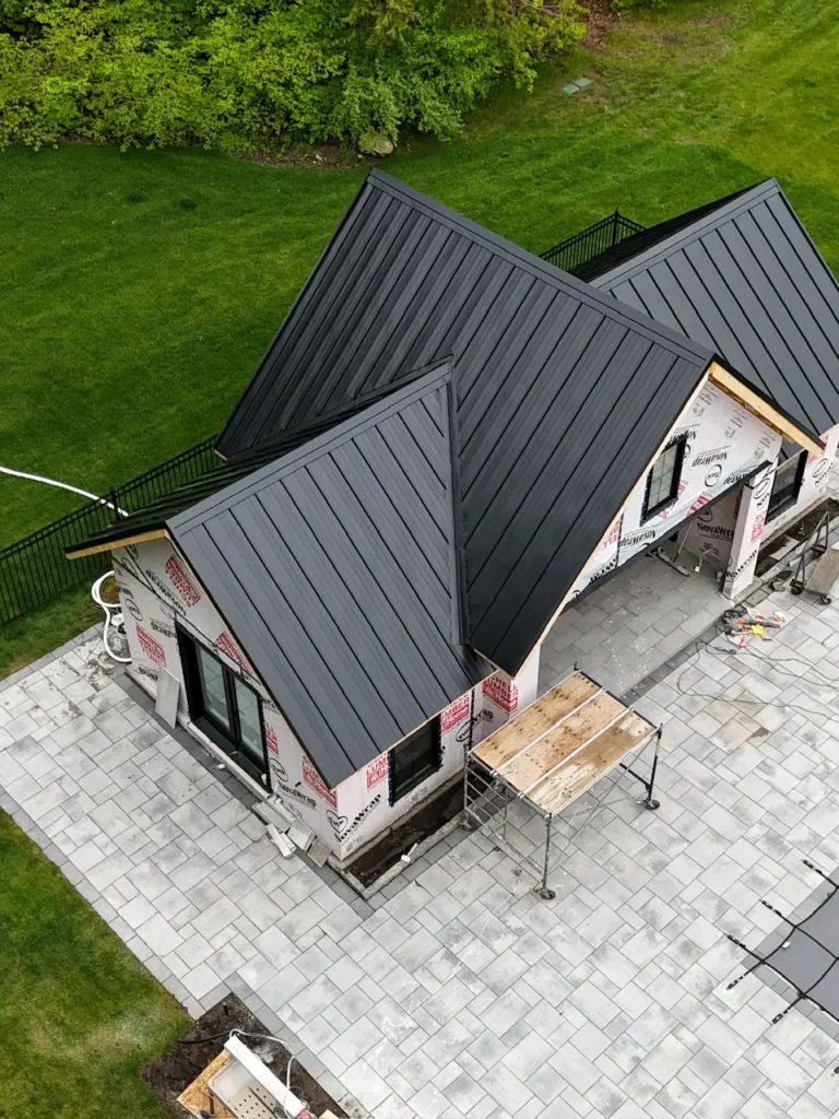 Exposed fastener metal roofing panels installed on an agricultural building in Ontario