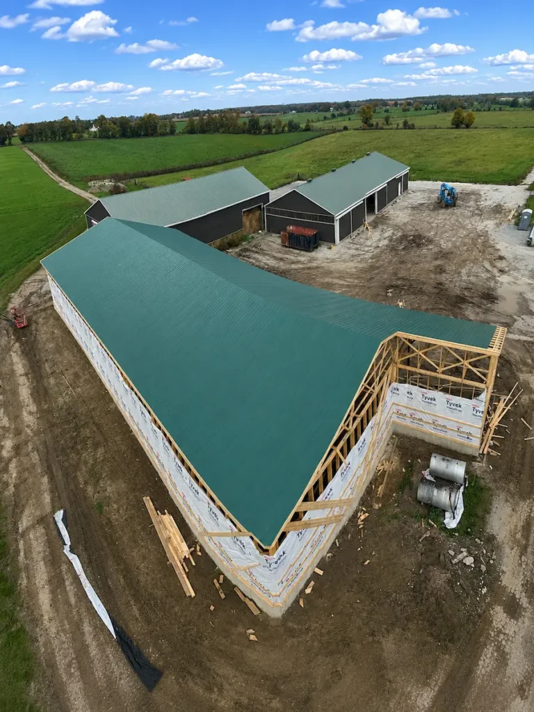 Heritage barn restoration with repaired timber frame and new cladding in Northumberland County