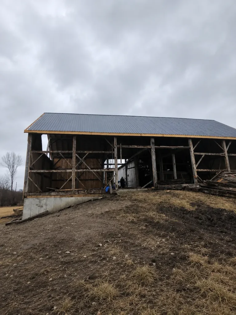 Steel pole barn framing and exterior panel installation by N.S. Custom Contracting