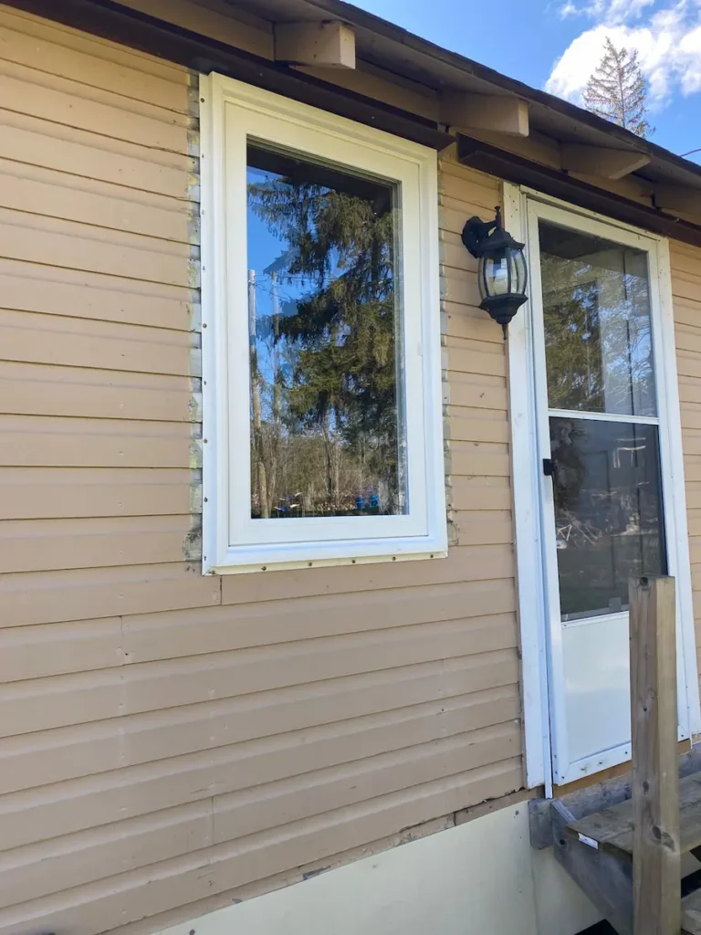 two replacement windows in sequence along front elevation