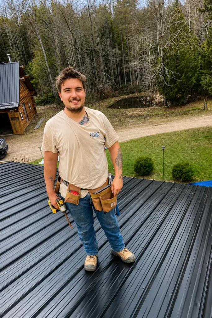 Finished black steel roof on a Pontypool home with rooftop solar panels