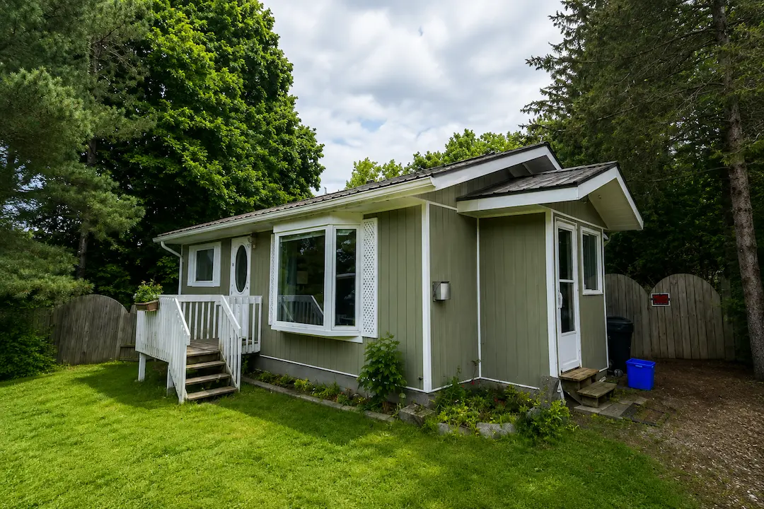 Ontario bunkie building permit guest cabin with board and batten siding Northumberland County