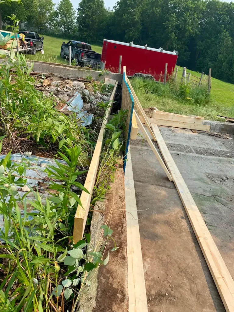Formed wall down its full length, walers and kickers in place