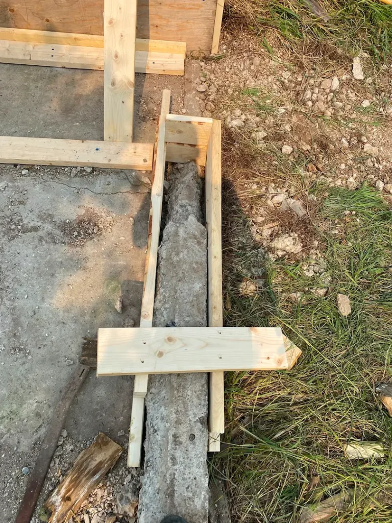 Formwork detail — forms built along the broken-out section, staked and braced