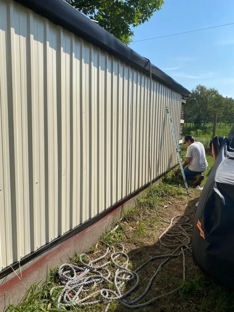 steel siding partway down the wall on the restored building
